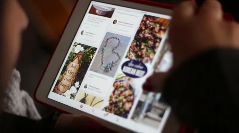 Woman Browsing on Pinterest Through Tablet Stock Footage 62048660