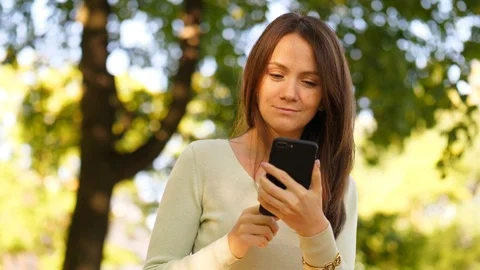 Woman browsing in smartphone Stock Footage 91989015