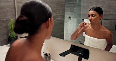 Woman, brushing and teeth with mirror in bathroom for dental hygiene, cleaning Stock Footage 295835331