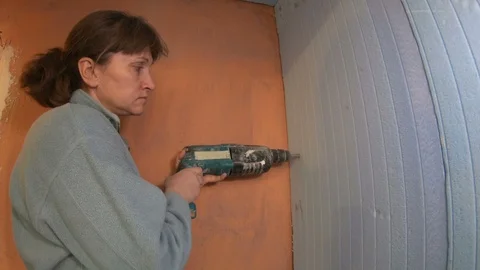 Woman builder with construction tools. Video stock 120287644