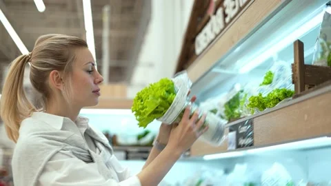 Woman buy healthy food grocery store. Vegan person select salad market. Eco shop Stock Footage 238497505