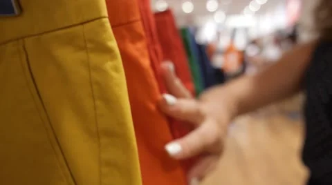 Woman Buying Clothes in Shopping Mall Stock Footage
