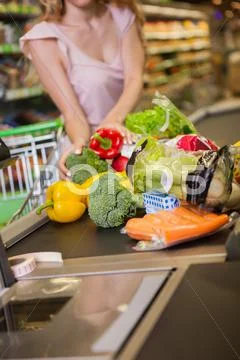 Woman Buying Food At The Grocery Store