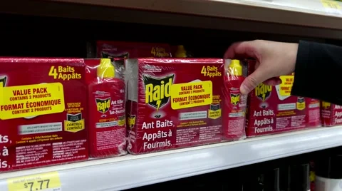 Woman buying Raid value pack inside Walmart store Video stock 64981016