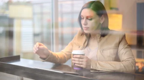 Woman in cafe with tablet (Focus on the tablet) Stock Footage 68005011