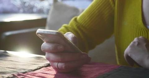 Woman in the cafe using smartphone while waiting. Stock Footage 86056808