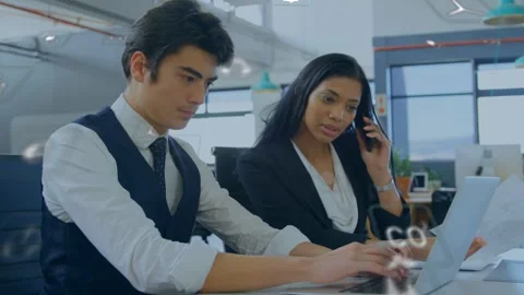 Woman calling and pointing docs while man typing, initiating laptop data entry Stock Footage 335761958