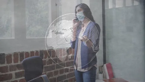 Woman calling client beside window fading in rotating wireframe globe for Stock Footage 328837304