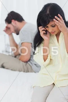 Woman calling someone during dispute Stock Photos