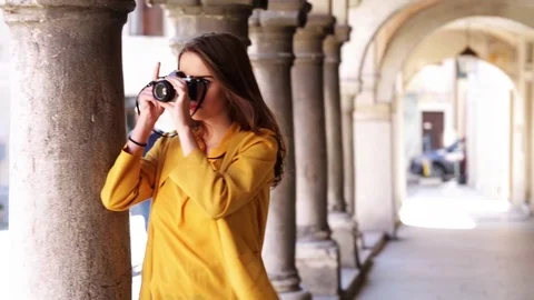 Woman with camera Stock Footage 106095840