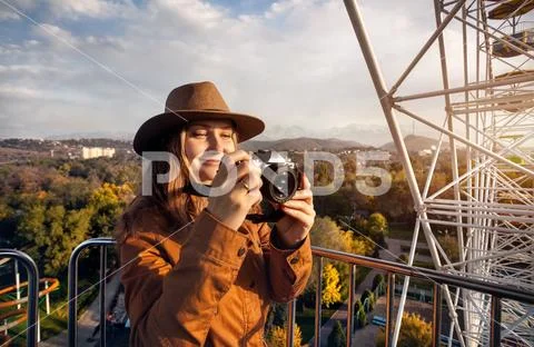 Woman with camera ride Ferris wheel Stock Photos
