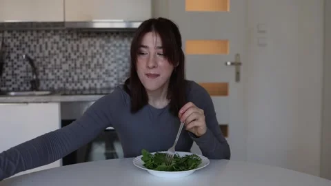Woman cannot resist sweet chocolate craving Video stock 334577832
