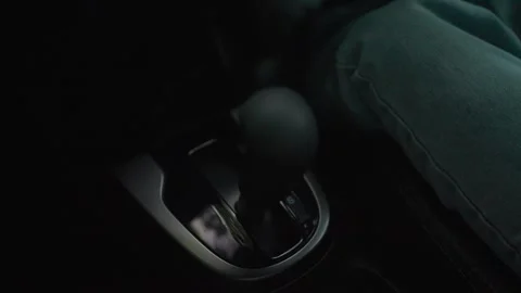 Woman car owner changes automatic transmission, driving mode, parking. The drive Stock Footage 264105393