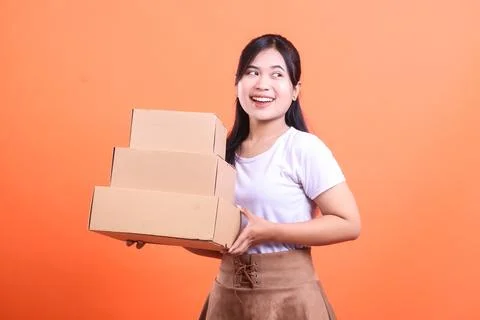 Woman Carrying Stack of Boxes Stock Photos