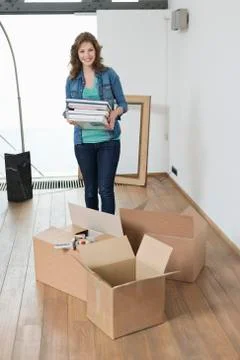 Woman carrying stack of magazines Stock Photos