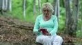 Woman with cell phone in the forest HD Footage