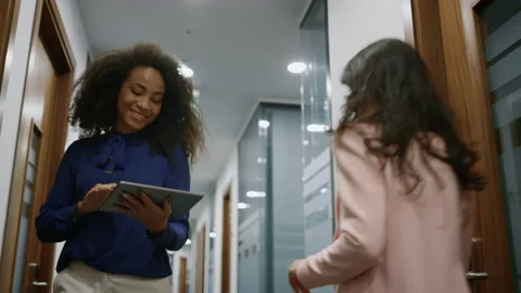Woman ceo searching tablet walking office meeting collegue in business room. Stock Footage