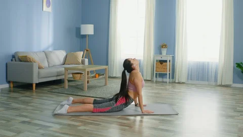 Woman Changes Basic Yoga Poses Video stock 128426219