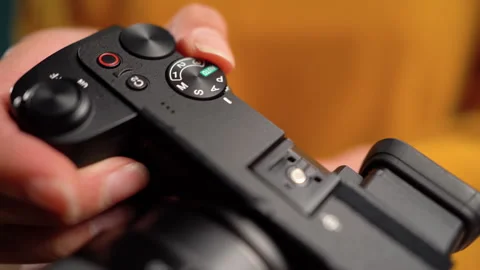 Woman changes modes setting on her camera Stock Footage 309446781