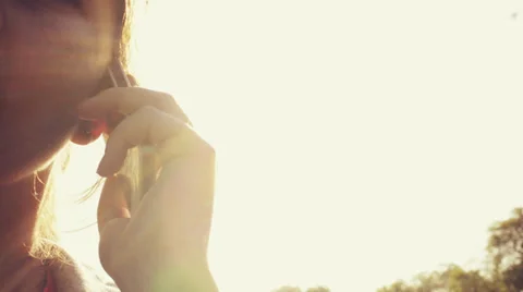 Woman chatting mobile phone outdoors Stock Footage