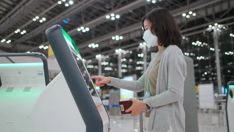 Woman checkin with automatic checkin machine Stock Footage 172196009