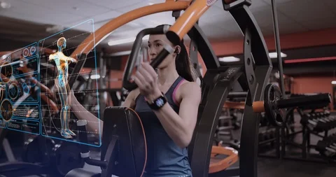 Woman checking activity tracker at the gym Stock Footage 123403804