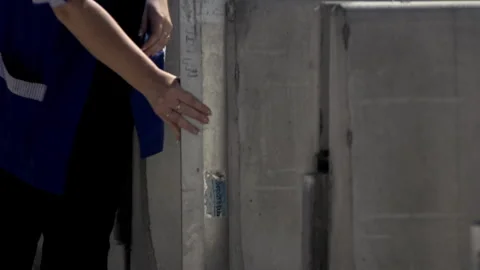 Woman checking barrier Stock Footage 263966304