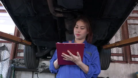Woman checking car Stock Footage 177940203