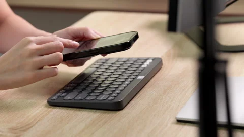 Woman checking data on smartphone at home office. Stock Footage 316657144