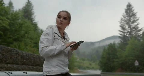 Woman checking direction on smartphone while hiking Stock Footage 158729907
