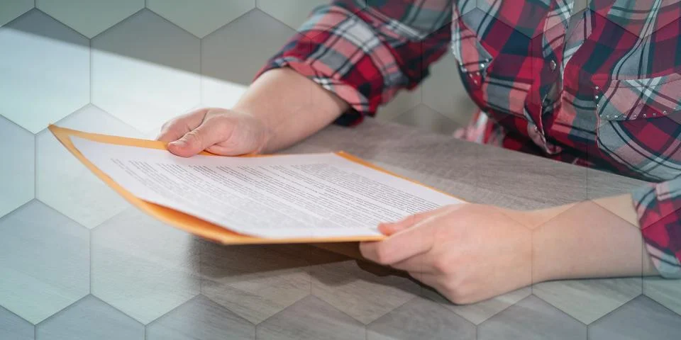 Woman checking a document, geometric pattern Stock Photos