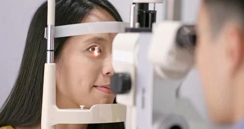 Woman checking on eye Stock Footage 91923500