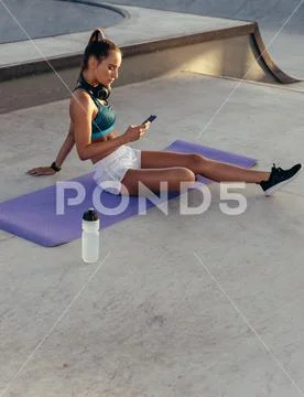 Woman checking her fitness performance Stock Photos
