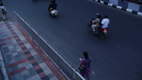 Woman-checking-her-phone-while-walking-on-the-road Stock Footage 95920691