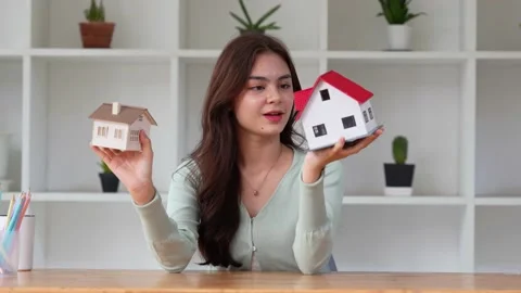 A woman checking house model .Real Estate House Appraisal And Inspection concept Stock Footage 201644779