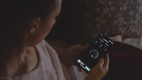 Woman checking the internet speed on mobile phone, using speed app. Stock Footage 250359703