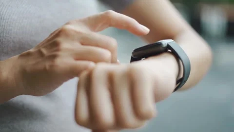 Woman checking notifications on her smartwatch Video stock 333739779
