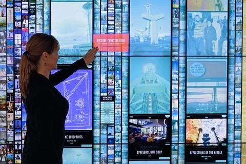 Woman checking out interactive display, Space Needle, Seattle, Washington Stock Photos