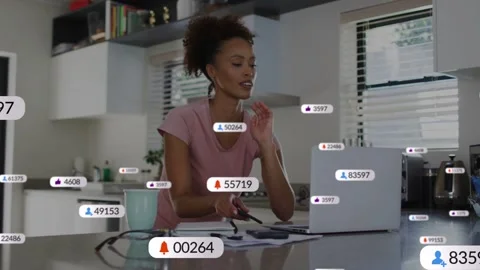 Woman checking phone in kitchen, tapping, spawning HUD badges, then typing on Stock Footage 333925363