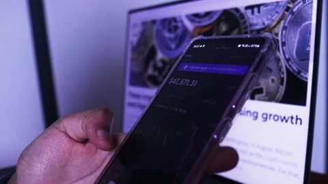 Woman Checking Real-time Updates Of Bitcoin Stocks On Mobile Phone Stock Footage 160485928