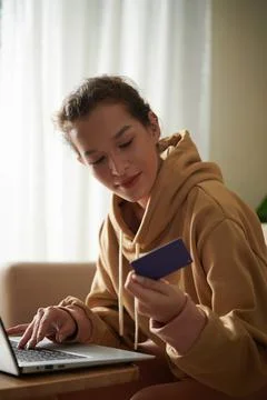 Woman Checking Security Code on Credit Card Stock Photos