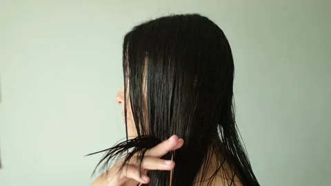 Woman Checking Split Ends and Hair Quality 스톡 동영상 339718487