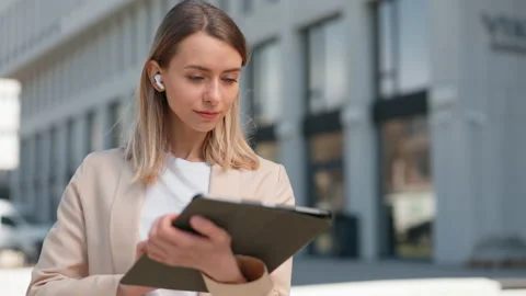 Woman checking work mailbox on digital tablet outdoor Stock Footage 196988809