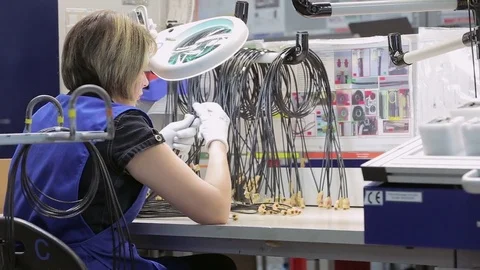 Woman checks cable defects Stock Footage 75326251