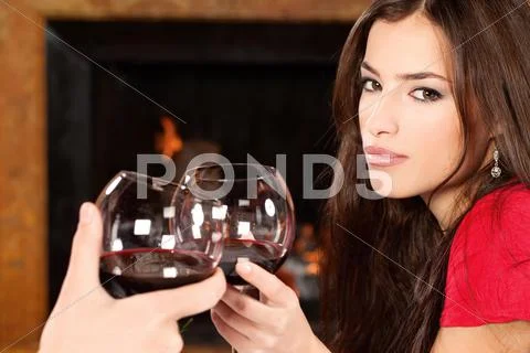 Woman cheers with someone Stock Photos