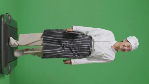 Woman Chef Holding A Tablet While Walking On Treadmill In The Green Screen Stock Footage 249622432