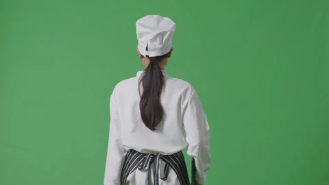 Woman Chef Holding A Tablet While Walking In The Green Screen Background Studio Stock Footage 249623631