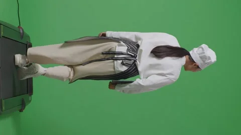 Woman Chef Holding A Tablet While Walking On Treadmill In The Green Screen Stock Footage 249623749