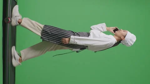 Woman Chef Talking On Smartphone While Walking In The Green Screen Background Stock Footage 249622723