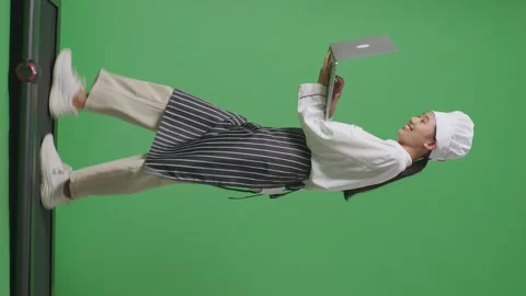 Woman Chef Using A Laptop While Walking On Treadmill In The Green Screen Stock Footage 249622939